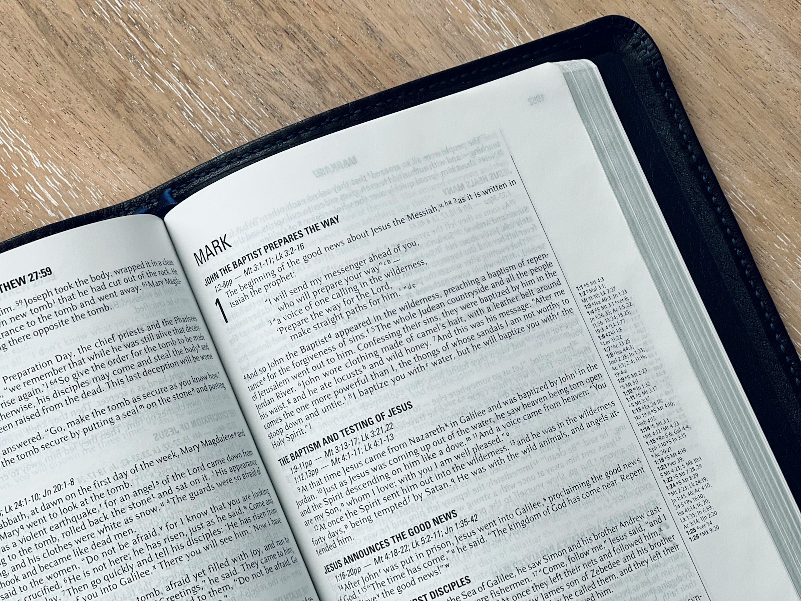 an open book sitting on top of a wooden table